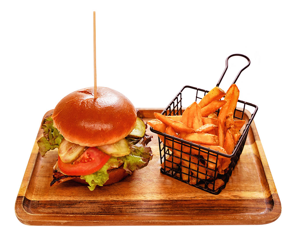Chickenburger mit Pommes – knusprig und frisch Chickenburger mit Salat, Tomate und Gurke im Brioche-Bun, serviert mit Steakhouse-Pommes
